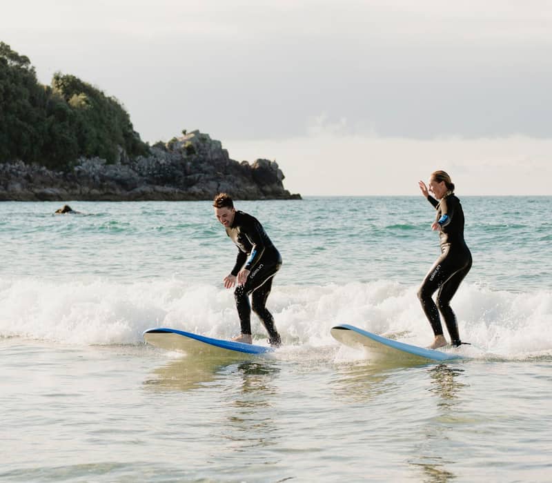Surfing on Mount Maunganui main beach.